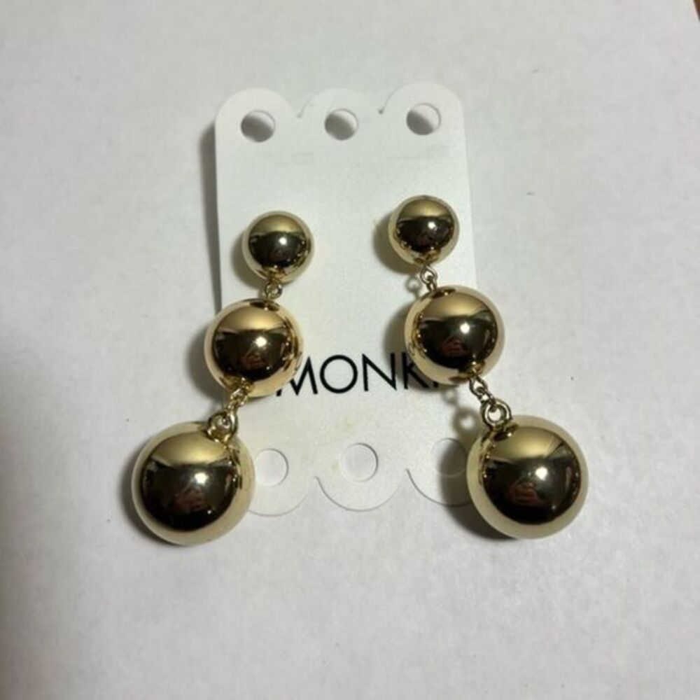 Three pairs of ball dangle statement earrings, gold and purple colors